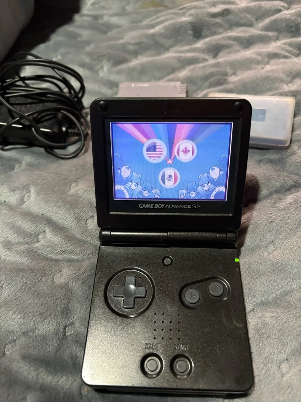 Nintendo Game Boy Advance SP Black with Pokémon sapphire, Zelda, Care Bears